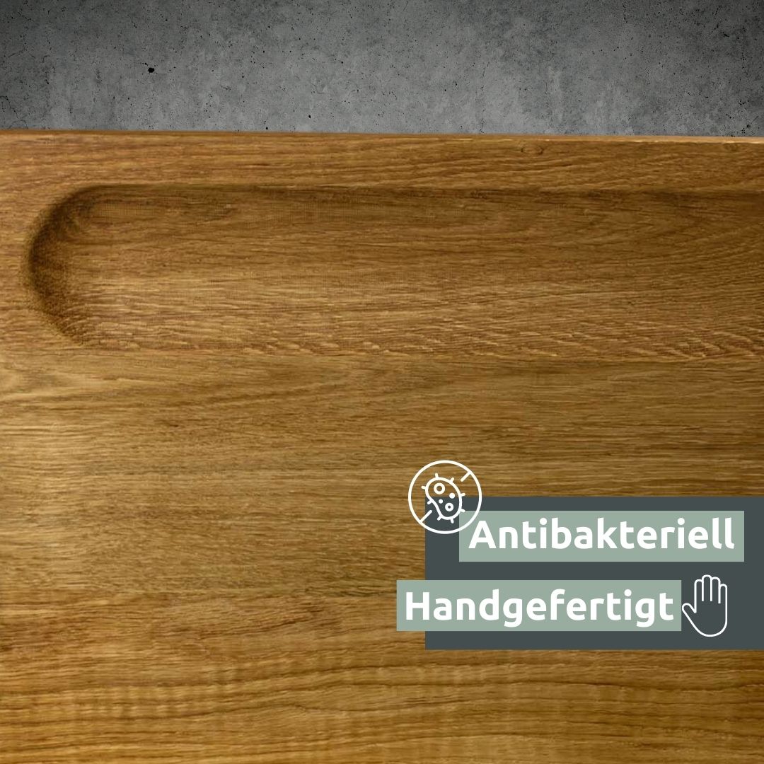 Close-up van de handgemaakte greepuitsparing in de eikenhouten plank Alina