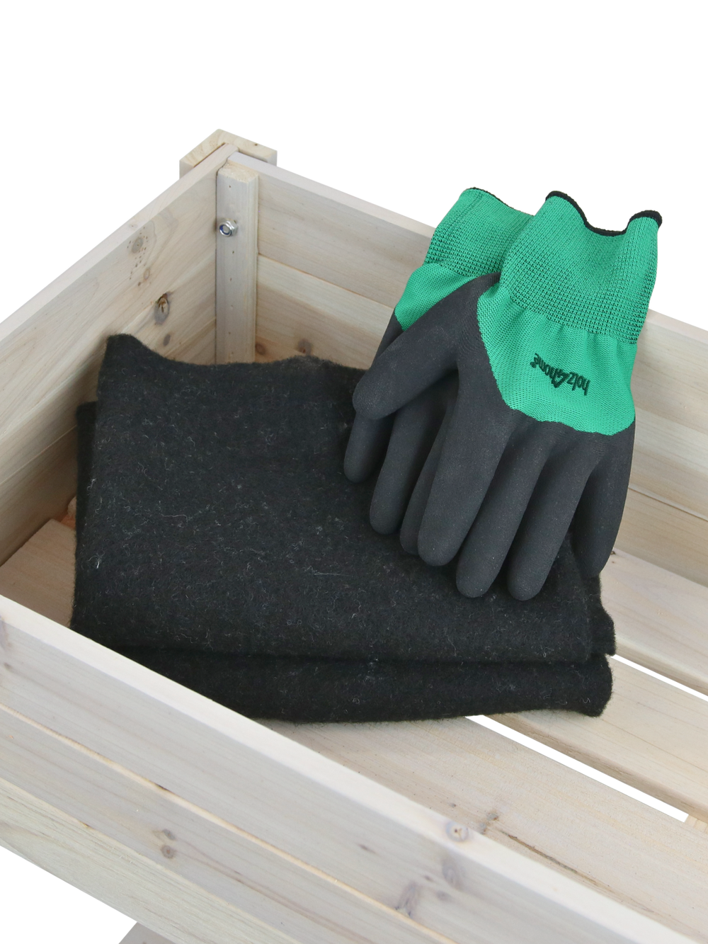 Accessoires bij de moestuinbak: gevouwen vlies als inlegfolie en tuinhandschoenen