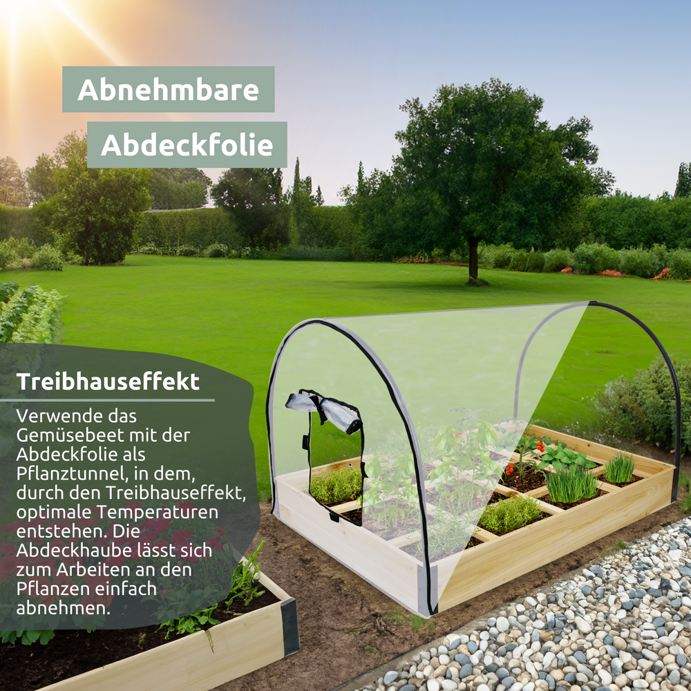 Moestuinbak met pvc-afdekkap als kweektunnel in de tuin op het gazon