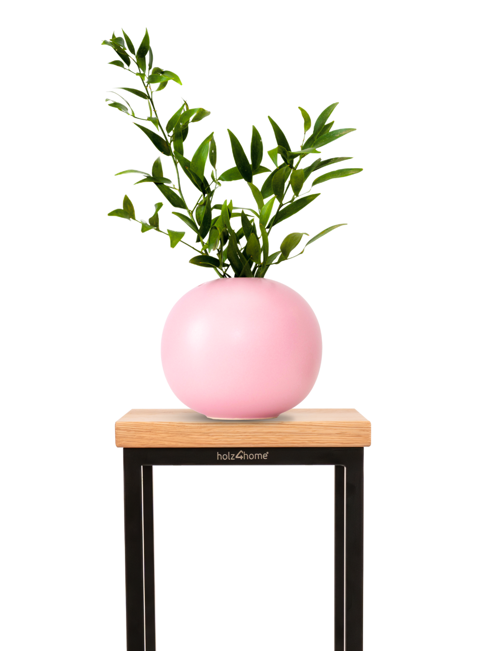 Bloemenstandaard van eiken met zwart onderstel en roze bolvaas met groene takken als decoratie