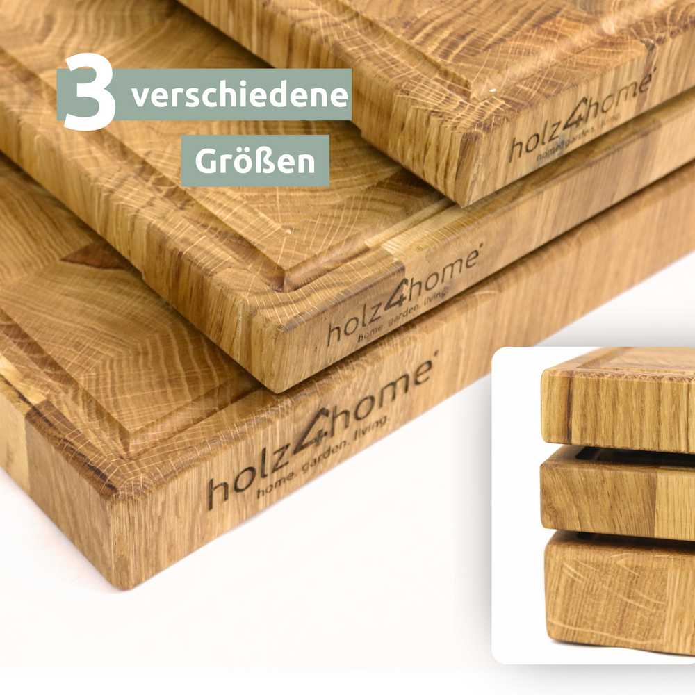 Drie gestapelde kopshouten snijplanken van eikenhout in verschillende groottes