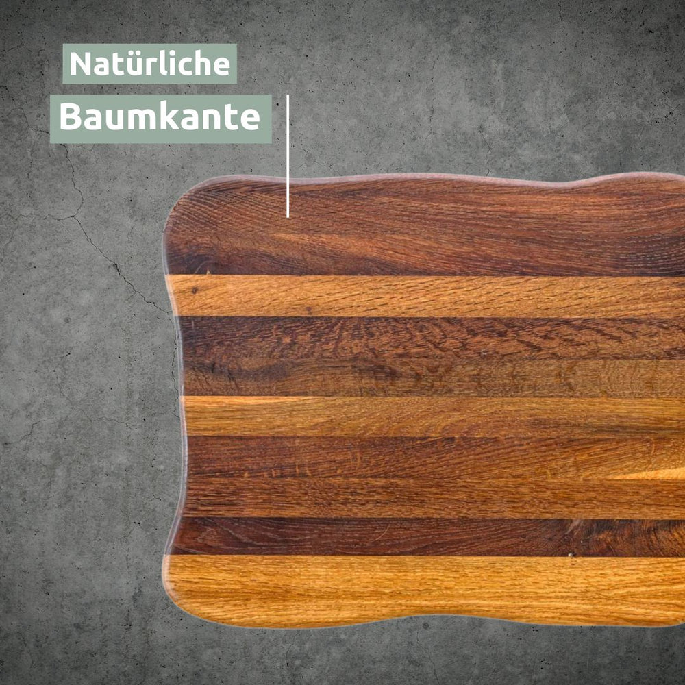 Detail van de natuurlijke golvende boomstamrand aan de donkere La Madera snijplank Top van eikenhout